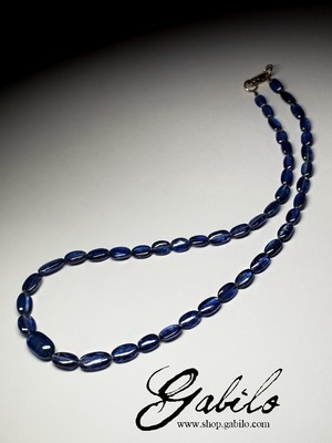 Beads from kyanite with a golden lock