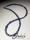 Beads from kyanite with a golden lock