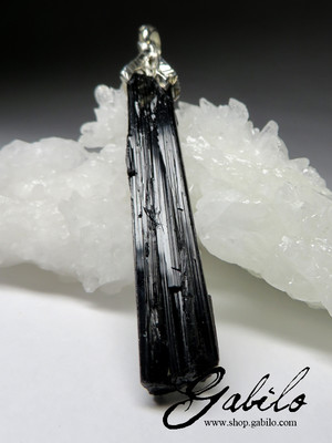 Crystal of black tourmaline on a cord