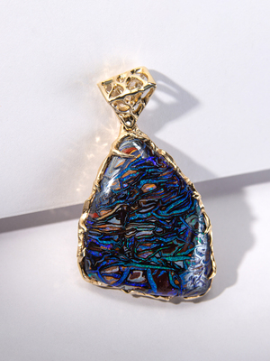 Boulder opal pendant in yellow gold