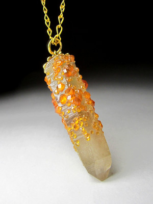 Pendant with garnet spessartine on rock crystal