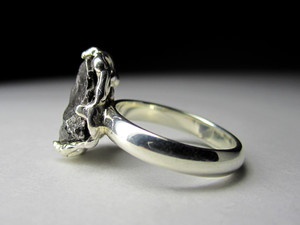 Silver ring with a meteorite