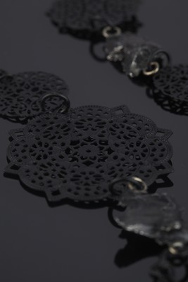 Necklace from meteorites with metal lace
