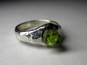 Ring with a crystal of a demantoid