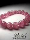 Certified beads from tourmaline with the effect of a cat's eye