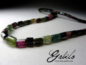Beads made of tourmaline faceting on the sides of crystals