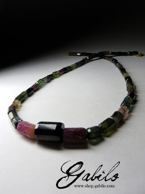 Beads made of tourmaline faceting on the sides of crystals