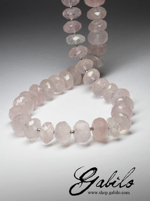 Large beads of pink quartz cut