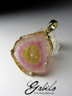 Gold pendant with a tourmaline slice