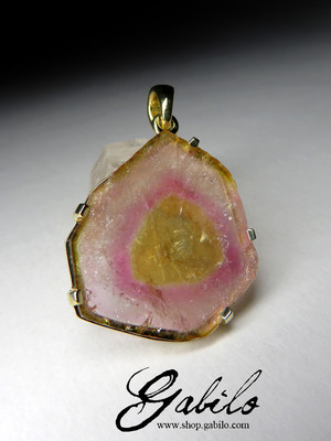 Gold pendant with a tourmaline slice