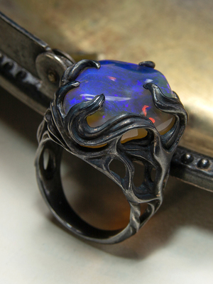 Big neon opal ring in patinated silver