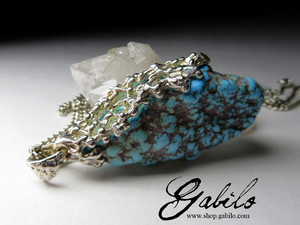 Silver pendant with turquoise nugget