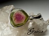 Silver pendant with a slice of polychrome tourmaline