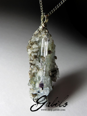 Pendant with a crystal of blue topaz