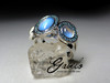 Moonstones gold ring with blue diamonds