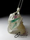 A large pendant with rock crystal and tourmaline in silver