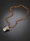 Astrophyllite in the breed on copper chains