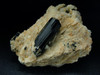 Crystal black tourmaline on the rock