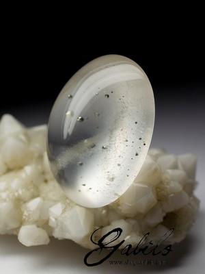 Rock crystal cabochon with pyrite 68 carats