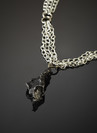 Pendant with a meteorite on silver chains