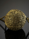 Suspension with a ball of pyrite